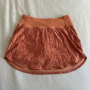 Outdoor Voices athletic skirt in patterned orange!
